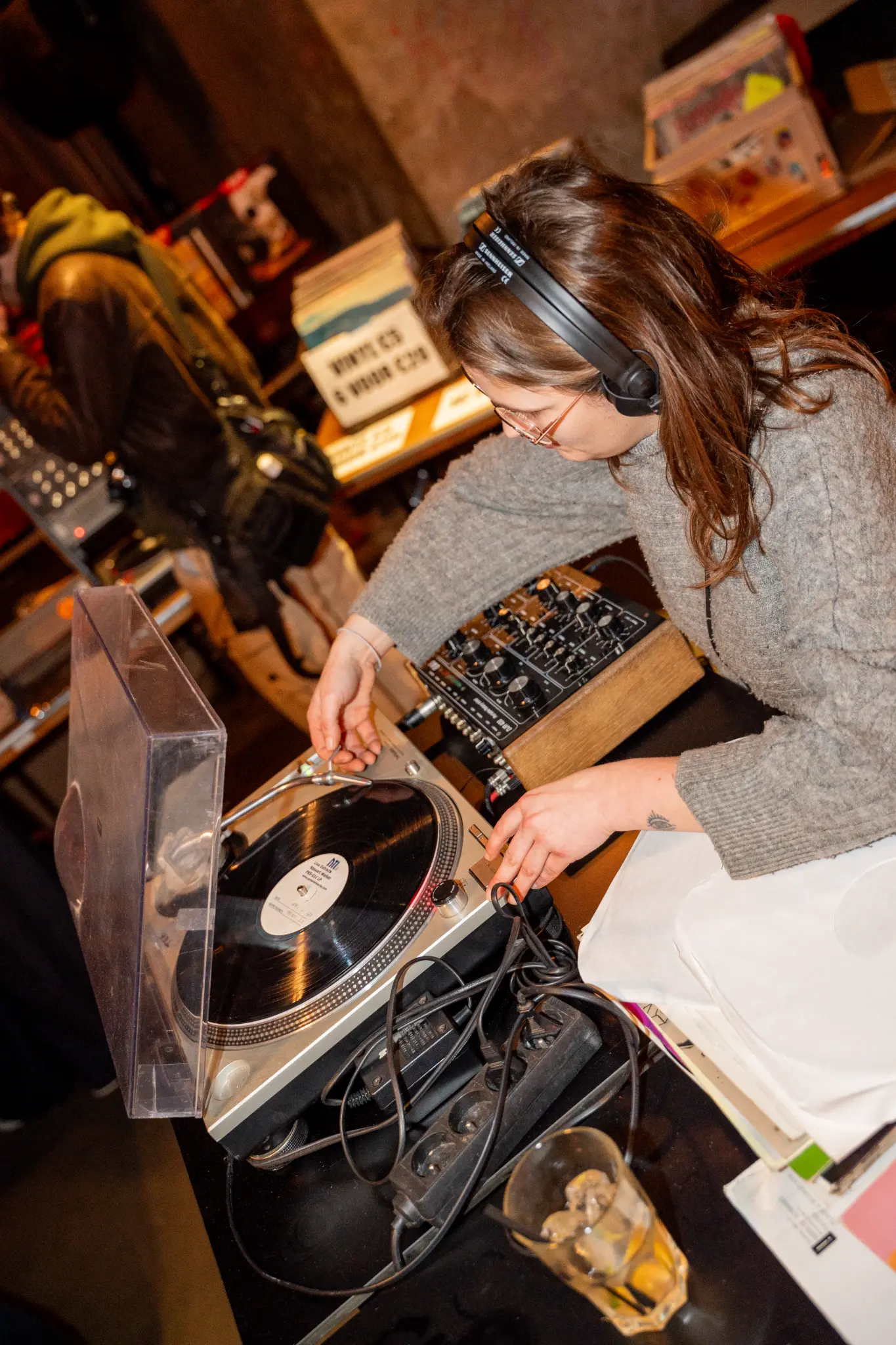 DJ on turntables at night event